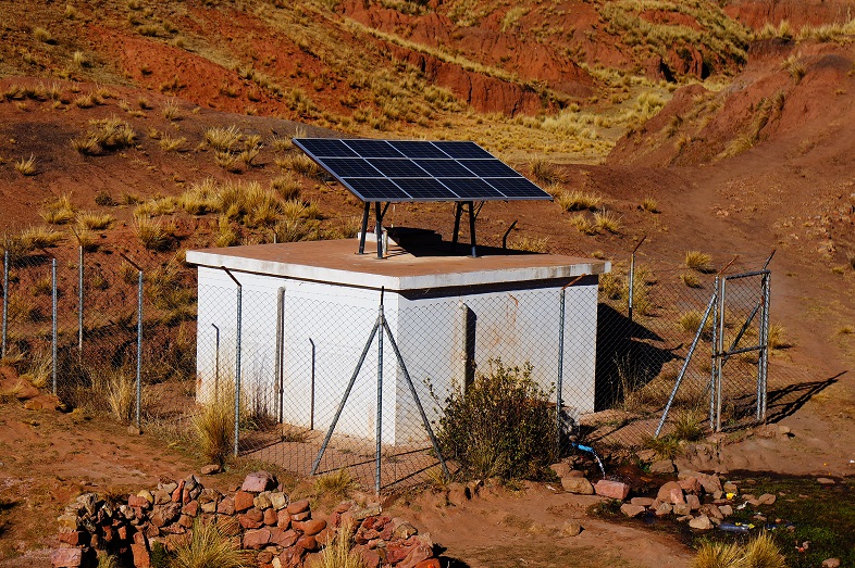 Solar panels installed on a water storage, protected by a fence