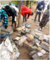 Collection of lead-acid batteries, Rhino Camp Refugee Settlement.png